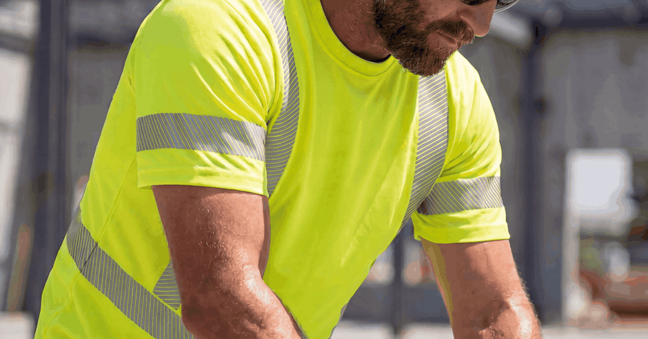 A close-up of a person wearing gloves, sunglasses, a yellow hi-vis shirt, and a yellow hi-vis hat while working outside.